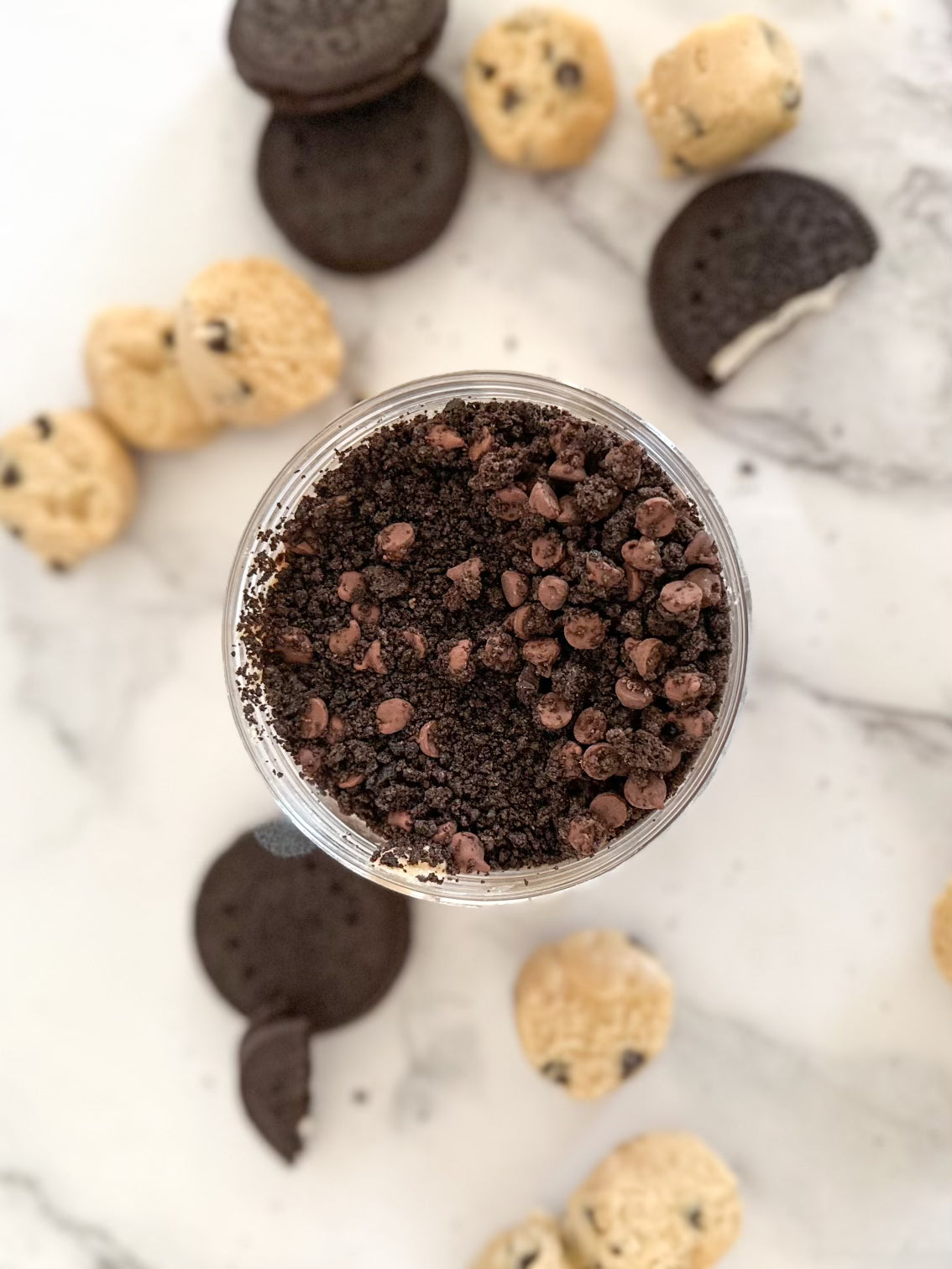 A bowl filled with cookies and chocolate chips, featuring cookie dough flavored cashew nut butter.
